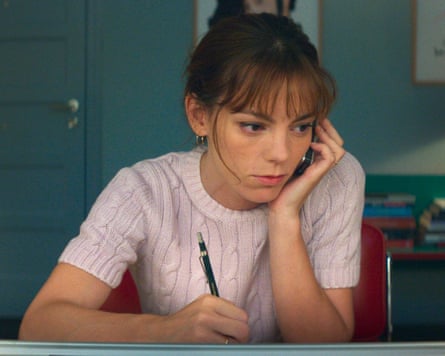 Woman on the phone writing something down