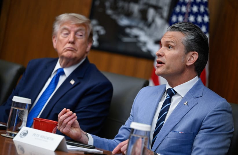 US President Donald Trump listens as Secretary of Defense Pete Hegseth speaks during a cabinet meeting at Camp David in Thurmont, Maryland, US, July 31, 2026.