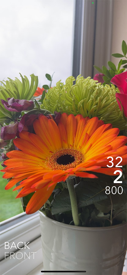 Lightmate app showing exposure and shutter speeds for a flowerpot placed on a windowsill
