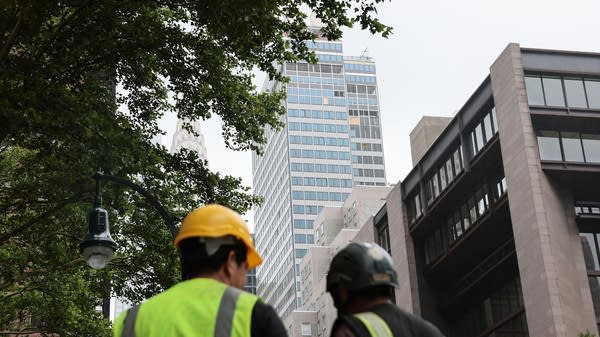 Above, a view of the former Pfizer headquarters, where columns buckled, in New York City on July 7. After fears of a collapse, the building has since been deemed stable.