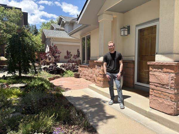 Man standing outside his house in Boulder, Colorado