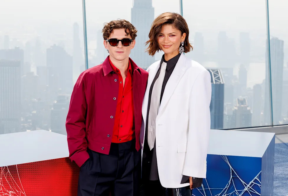 Tom Holland and Zendaya posing for a photo.