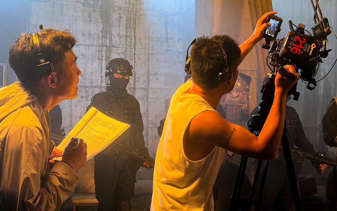 A cameraman optimizes a shot for mobile phone consumption at a Hengdian microdrama film set in June.
