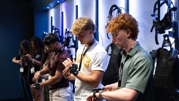 Students trying on VR headsets