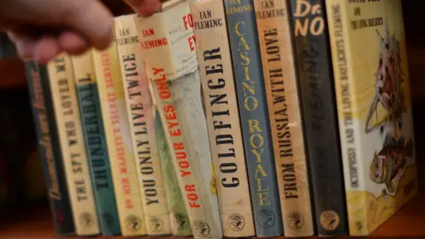 Getty Images A collection of Ian Fleming James Bond novels stacked up against each other