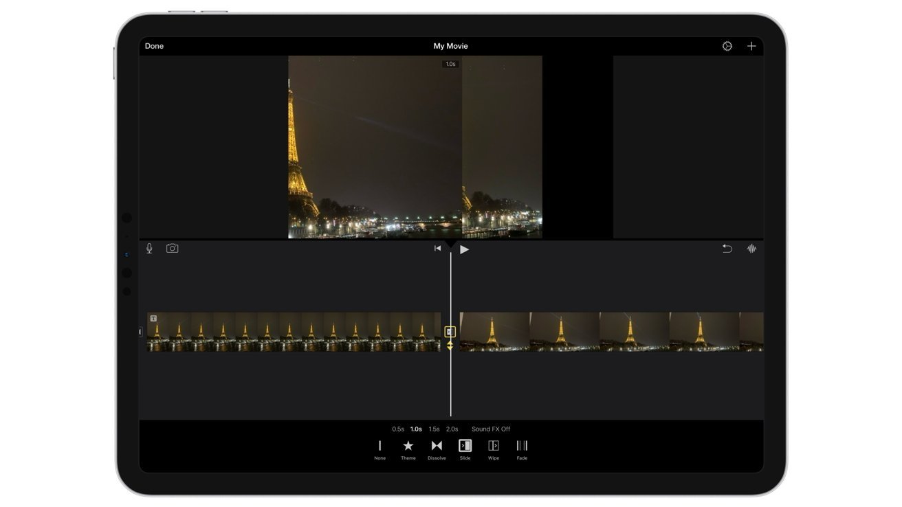 Tablet screen showing a video editing app with nighttime Eiffel Tower footage on the preview and a timeline of video clips and tools along the bottom