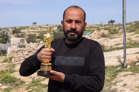 No Other Land co-director Hamdan Ballal with his Oscar in March 2025, shortly after he had been attacked by Israeli settlers at his home, in his village of Susya in the occupied West Bank.