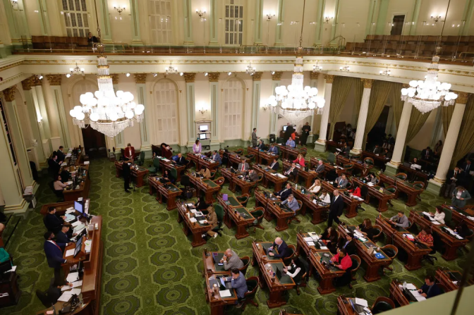 A high angle view of people in desks on the assembly floor.