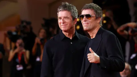 Reuters Noel and Liam Gallagher at the Venice Film Festival, they are both wearing black and Liam is wearing black