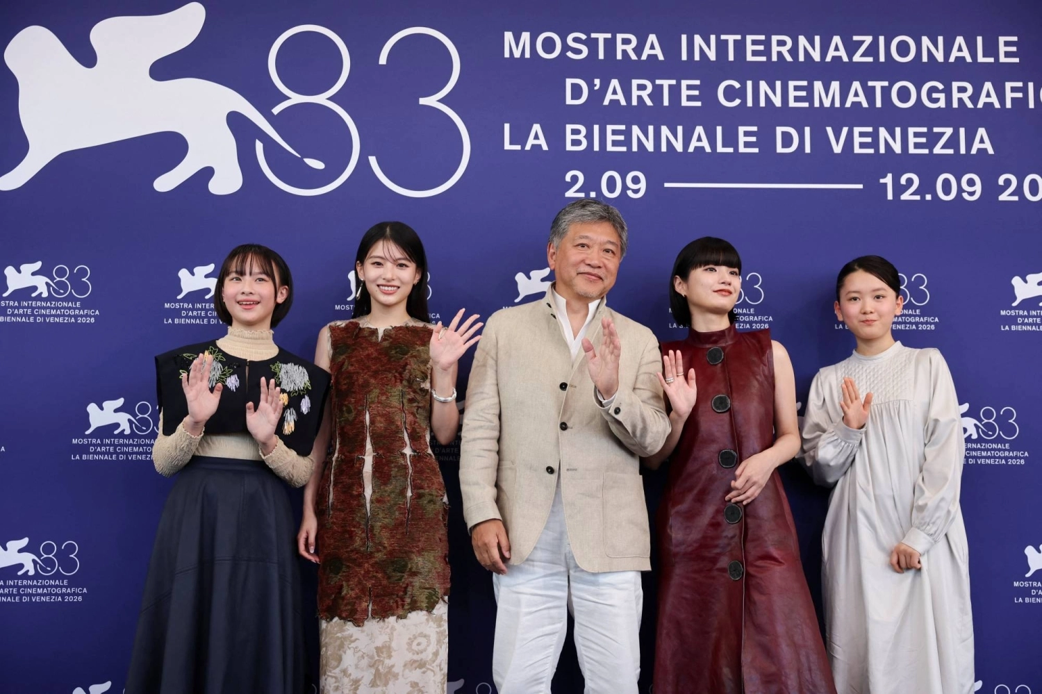 Director Hirokazu Kore-eda and cast members Miyu Sasaki and Natsuki Deguchi pose during a photocall for the movie