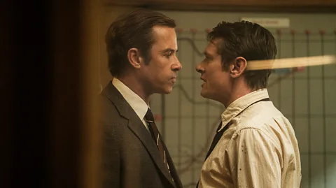Studio Canal Guy Pearce and Jack O'Connell stand face to face in Ink (Credit: Studio Canal)
