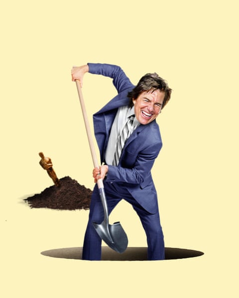 Tom Cruise digs a hole with a shovel beside a pile of dirt containing a buried Oscar statuette